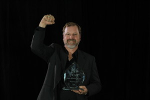 Rob shows off his Safe Driver Award and diamond-embedded gold ring.