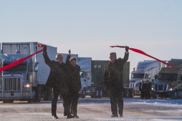 Former Prime Minister Stephen Harper and Manitoba Premier Greg Sellinger join CentrePort CEO Diane Gray to open CentrePort Way.