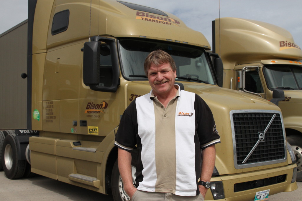 Driver in front of Bison truck